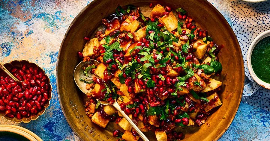Aloo Chaat – crispy Indian potato cubes with chaat masala, pomegranate and date‑tamarind sauce