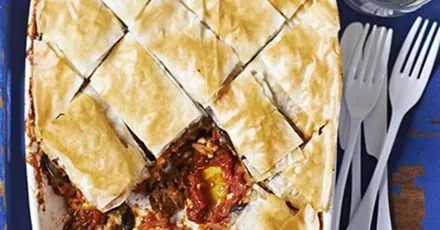 Baklava with aromatic eggplants, juicy tomatoes and feta crumble
