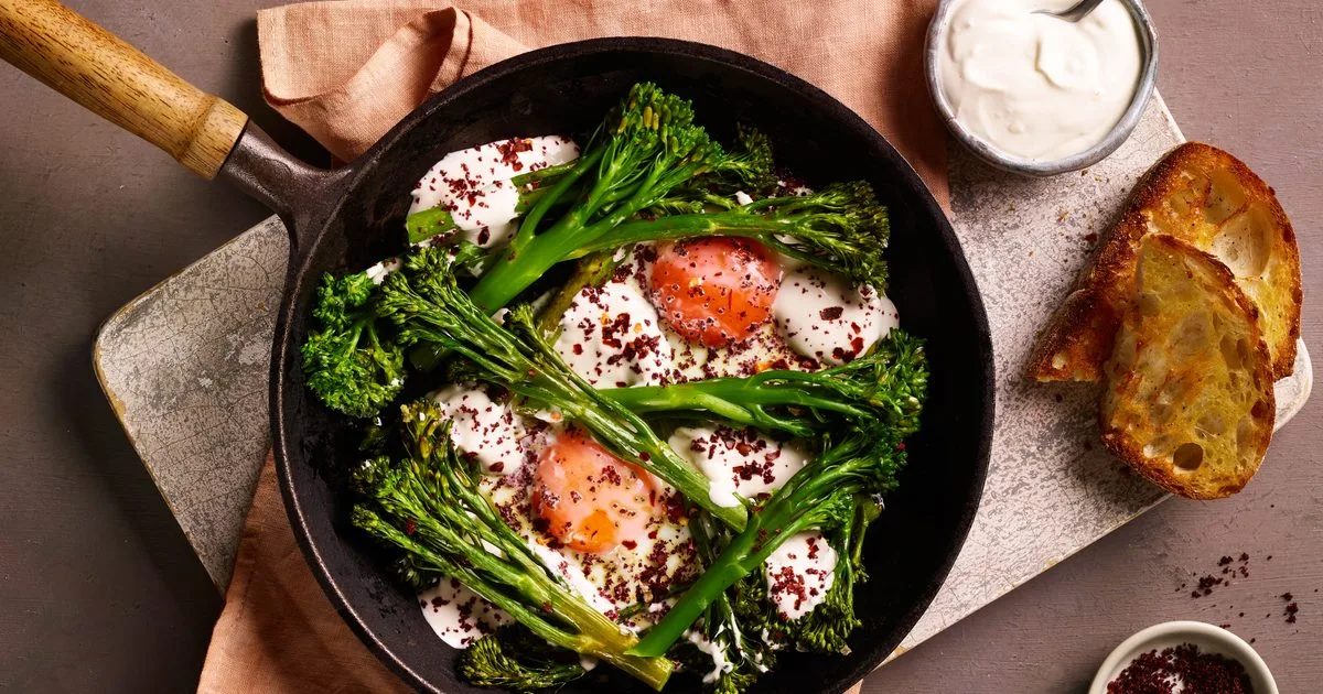 Baked eggs with sumac, tenderstem broccoli and tahini‑yogurt sauce
