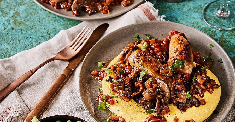 Braised Italian sausages with red wine, porcini mushrooms and creamy polenta