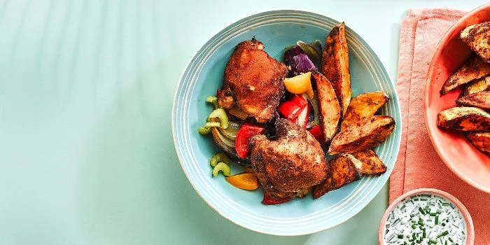 Cajun chicken baked with sweet potato wedges and chive onion sauce