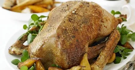 Christmas goose with root veg, sticky pears & bramble gravy