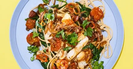 Cod puttanesca with spinach and spaghetti