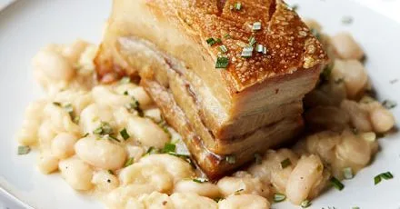 Confit pork belly with cannellini beans and rosemary