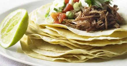 Cornmeal pancakes with spiced pork & avocado salsa