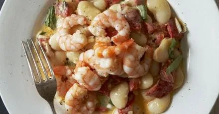 Creamy butter beans with quick fried prawns
