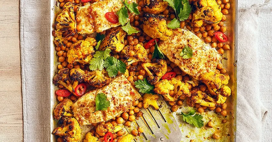 Butter-baked cod with curry, cauliflower and chickpeas