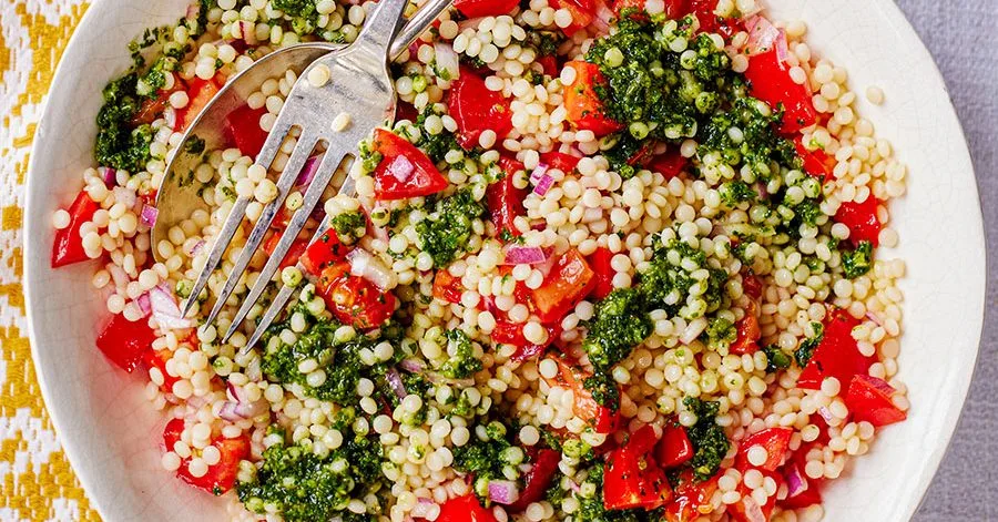 Giant couscous & tomato salad with zhoug-style dressing