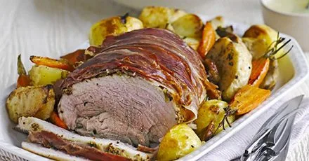 Herb roast pork with vegetable roasties & apple gravy