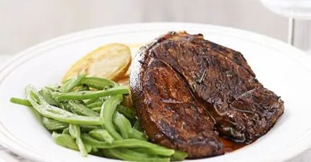 Lamb steaks with crispy potatoes & minted beans