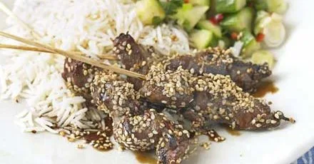 Sesame beef skewers with cucumber salad