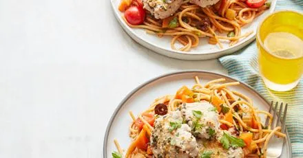 Parmesan pork with tomato & olive spaghetti