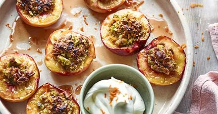 Roast pistachio-stuffed peaches with orange blossom cream
