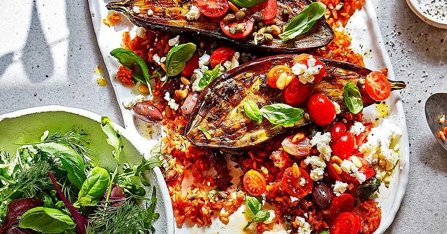 Roast puttanesca aubergines with tomato rice & feta