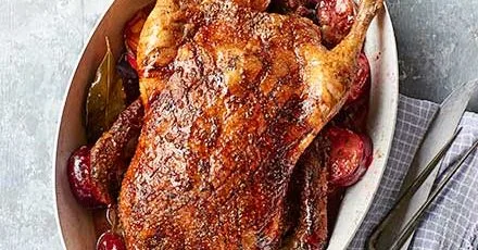 Roast spiced duck with plums
