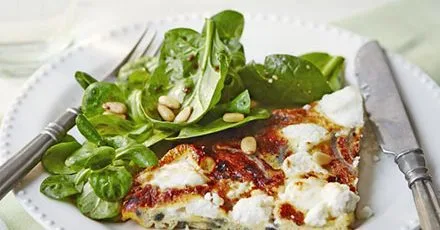 Slice of frittata with nutty green salad & balsamic dressing