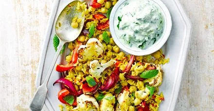 Spicy cauliflower rice with minty cucumber raita