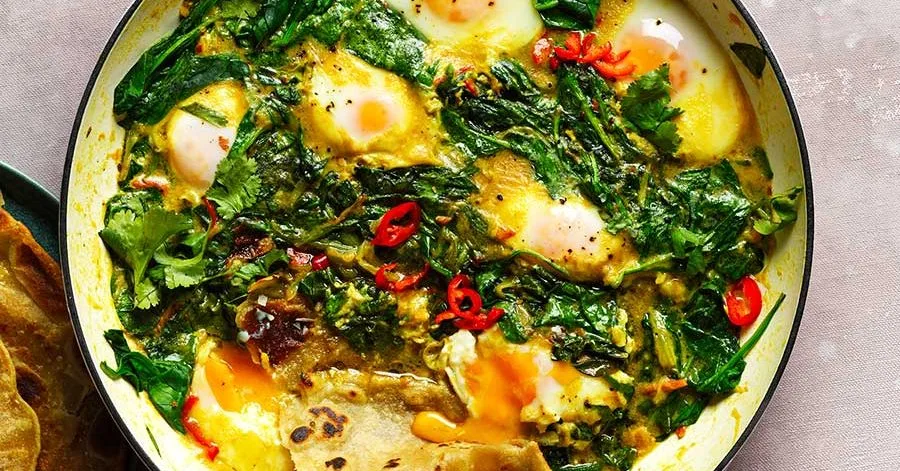 Spinach, coconut & turmeric baked eggs with paratha