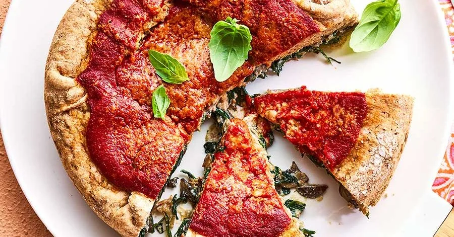 Spinach-stuffed pizza pies