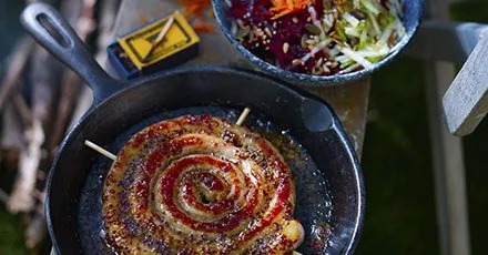 Sticky cider & mustard sausage wheel with box grater salad