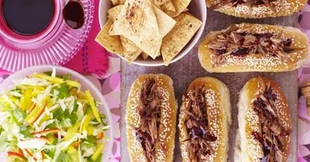 Sticky duck-dogs with chopped mango slaw & Chinese crisps