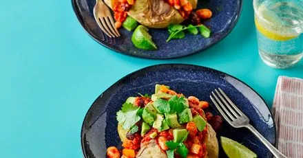 Vegan three-bean chilli with potato jackets