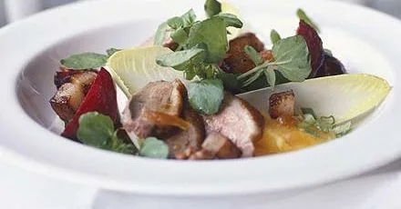 Warm duck salad with walnut & orange dressing