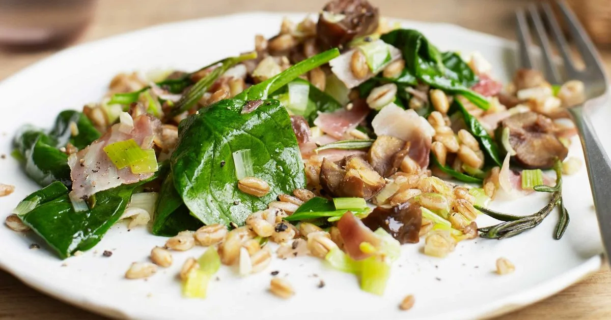 Warm grain salad with bacon, leeks & spinach