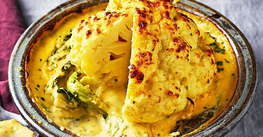Whole baked cauliflower cheese