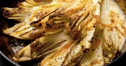 Wilted chicory with melted taleggio cheese