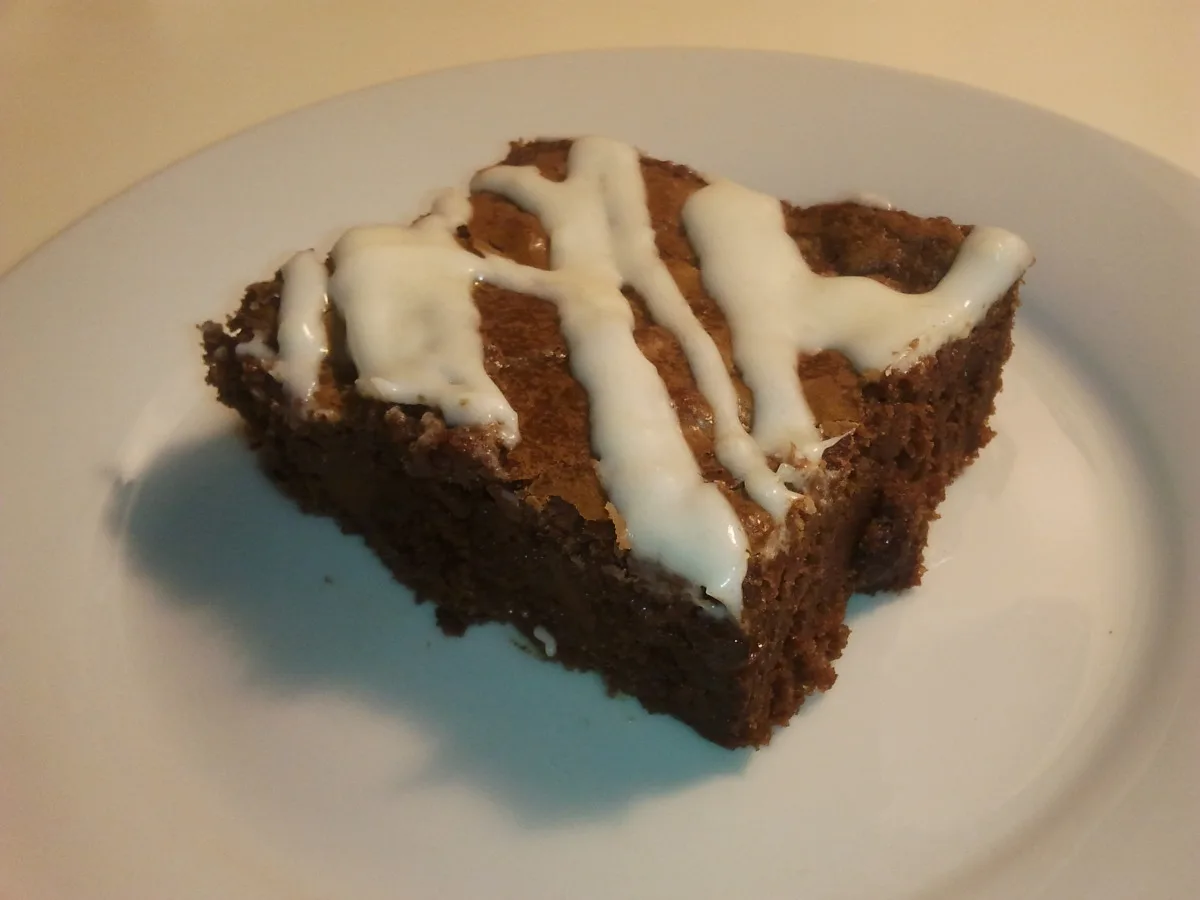 Dark Chocolate Chunk Brownies With Sweet Cream Cheese Drizzle