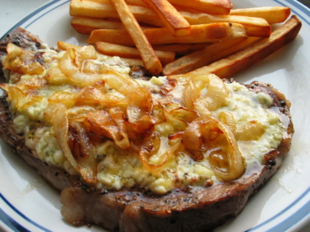 Pub Style Peppered Stilton Steaks With Charred Onions and Chips