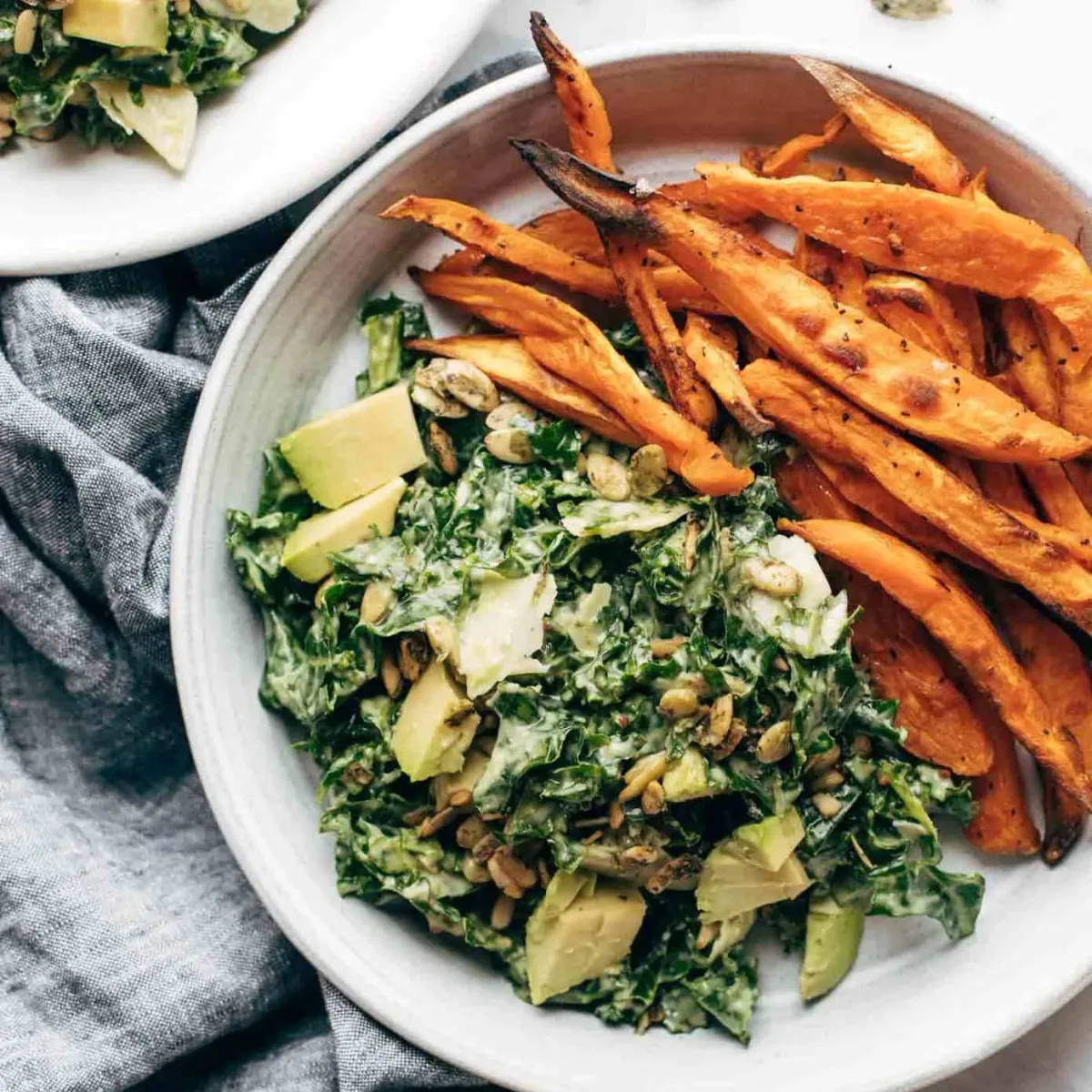 Avocado Kale Caesar Salad with Sweet Potato Fries